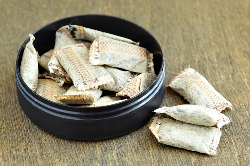 Smokeless tobacco in container.
