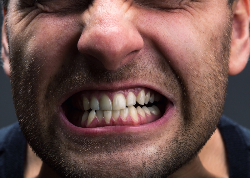 Man grinding teeth.