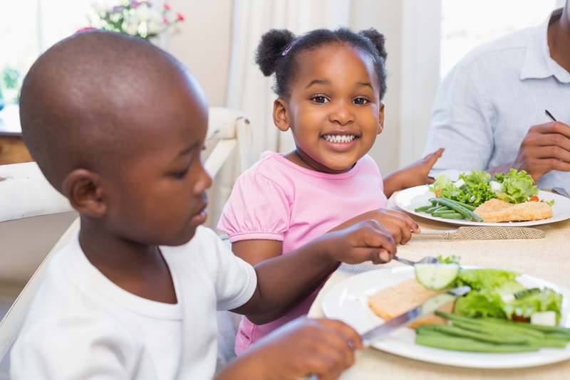 Children eating dinner.