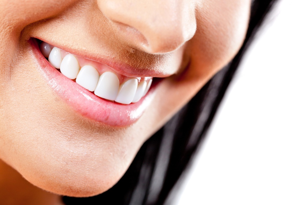 Beautiful smile of young woman with white teeth