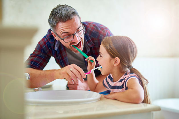 dad-daughter-brushing-teeth.png