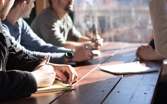 millennials sitting on bench office table.jpg